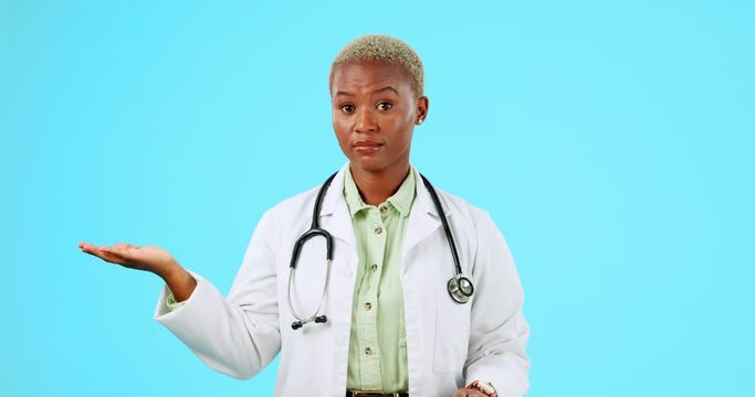 Doctor, hand space or black woman in studio with mockup for product placement on blue background. Yes, shaking head or African girl portrait in healthcare warning of choice or risk to stop danger