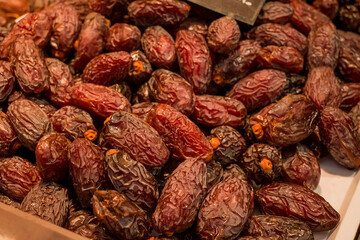 Date Fruits in row, semi dried.