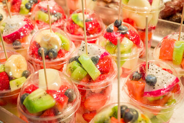 Fresh fruit juice Kiwi, Melons, Mango, Passion,  on ice at the market
