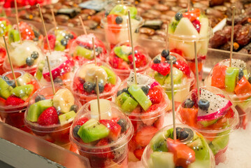 Fresh fruit juice Kiwi, Melons, Mango, Passion,  on ice at the market