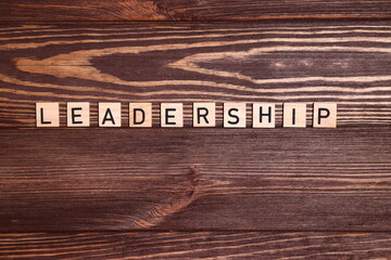 Leader, leadership, lead word on wooden background