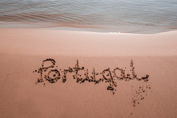 text Portugal in the sand on the beach