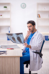 Fototapeta premium Young male doctor radiologist working in the clinic