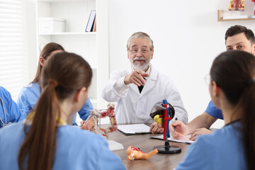 Doctor and interns on lecture in university