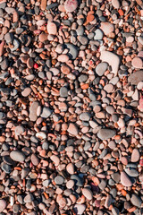 Sea pebbles. Small stones gravel texture background.