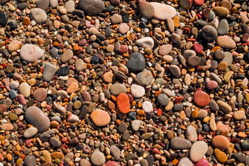 Sea pebbles. Small stones gravel texture background.