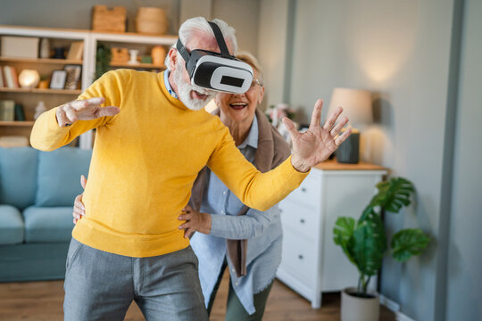 man mature senior male at home enjoy virtual reality VR headset