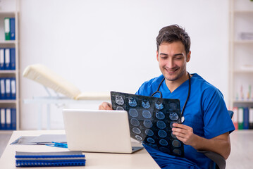 Young male doctor radiologist working in the clinic
