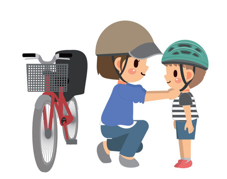 自転車用のヘルメットを子供にかぶらせているお母さん