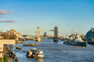 Tower Bridge half lit up by sunlight  in London. England