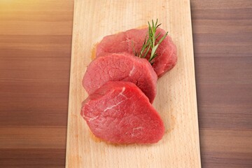 Tasty raw fresh meat on wooden board