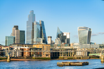 Fototapeta na wymiar Financial district of London seen through Millennium Bridge