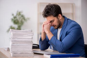 Young male employee working in the office