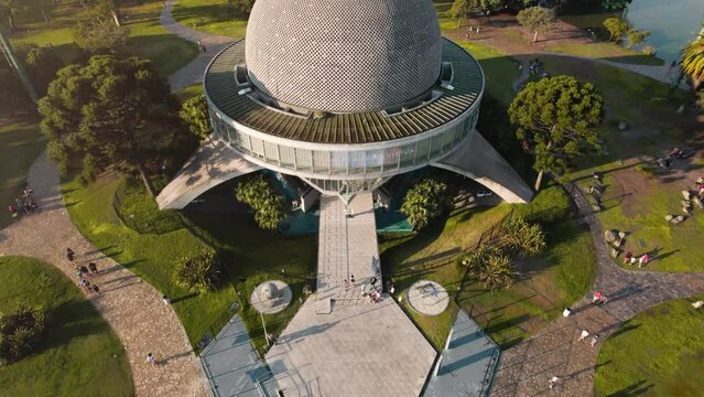 4k video aerial view of planetarium in the middle of the forests at sunset, palermo, buenos aires, argentina