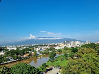 view of the cityView of the city of Chiang Mai in Thailand overlooking the top of Doi Suthep.  Bright sky, view from the ward at Rajavej Hospital