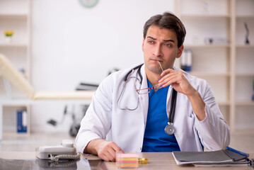 Young male doctor working in the clinic