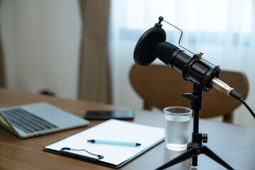Home studio podcast concept, Studio Condenser Microphone and laptop on the table.