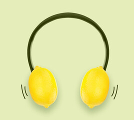 Yellow lemon headphones. Creative concept for summer celebrations and vacations