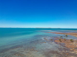 Aerial over the ocean and reed
