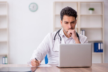 Young male doctor in telemedicine concept