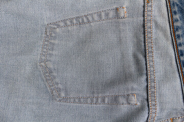 Close-up photo inside corner of jeans blue jeans denim blue cloth background.