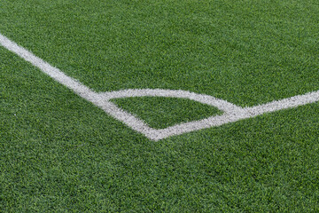 Corner of soccer field with green grass