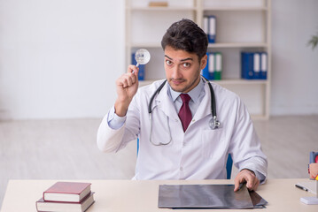Young male doctor radiologist working in the clinic