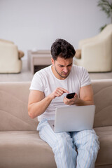 Young man starting day at home