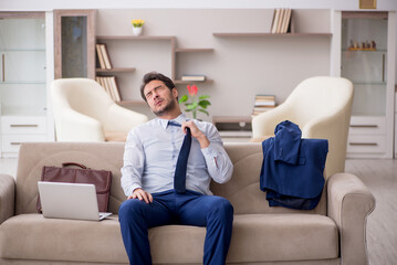 Young male employee working from home during pandemic