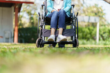 Young asian woman in wheelchair with positive thinking.