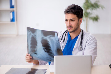 Young male doctor radiologist working in the clinic