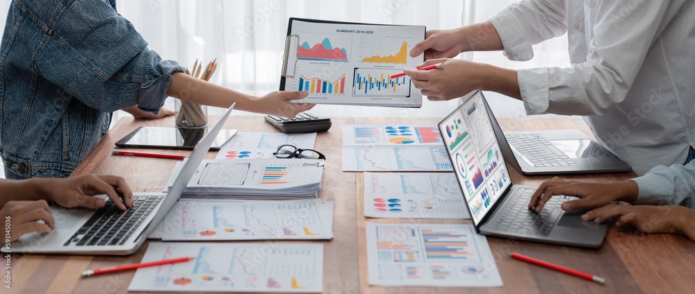Poster Panorama shot analyst team utilizing BI Fintech to analyze financial report with laptop. Businesspeople analyzing BI power dashboard displayed on laptop screen for business insight. Scrutinize