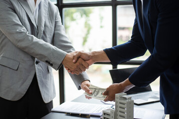 Salesman Hands On House Model , Small Toy House Small Mortgage Property insurance and concepts real estat