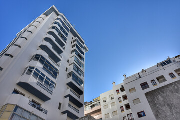 Low angle view of modern condo building in Armacao de Pera