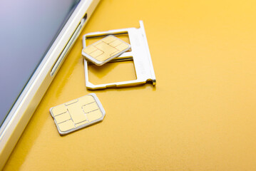 Broadband 5G mobile communication technology concept : SIM card tray / dual SIM card slot with two...