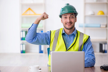 Young male architect working in the office