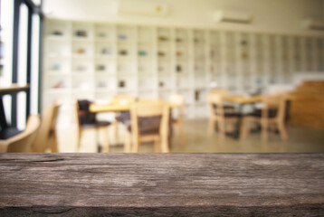 Empty wooden table in front of abstract blurred background of coffee shop . can be used for display Mock up  of product