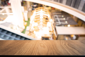 Empty wooden table in front of abstract blurred background of coffee shop . can be used for display Mock up  of product