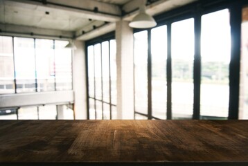 Empty wooden table in front of abstract blurred background of coffee shop . can be used for display or montage your products.Mock up for display of product