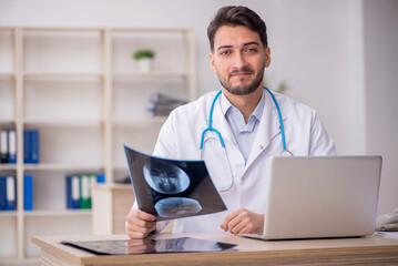 Young male doctor radiologist working in the clinic