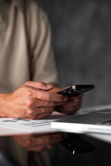 Vertical image of student hands using smart phone electronic learning. E-learning technology concept