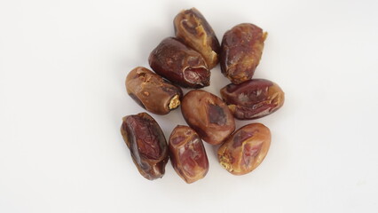 dried dates on a white background