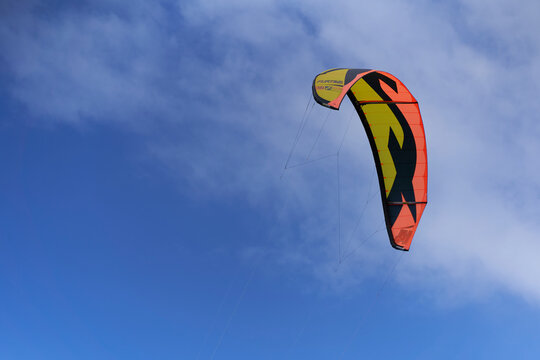 Tubekite for kitesurfing and kite foiling. Equipment isolated on blue sky. Sunny summer day. Low angle view.