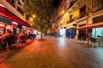 Shopping streets with restaurants at Madrid city at night