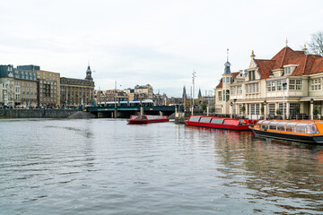 Open havenfront by central station in Amsterdam, The Netherlands