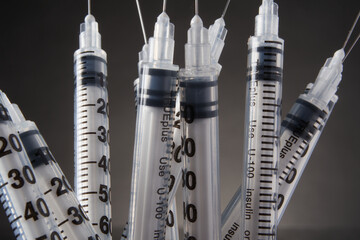 Clustered single use insulin syringes