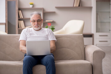 Old man sitting at home