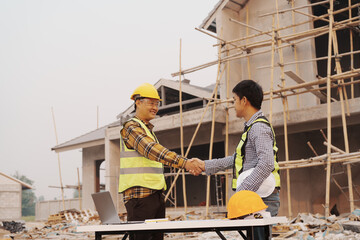 Team of engineer and worker checking construction site outdoors Surveyor builder Engineer surveying...