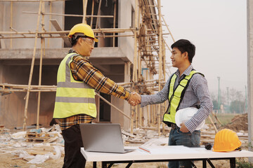 Team of engineer and worker checking construction site outdoors Surveyor builder Engineer surveying...