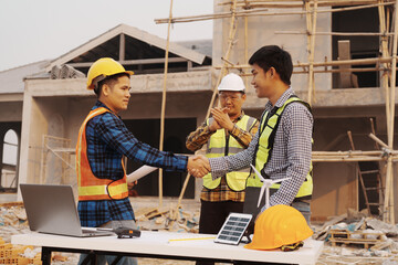 Team of engineer and worker checking construction site outdoors Surveyor builder Engineer surveying...